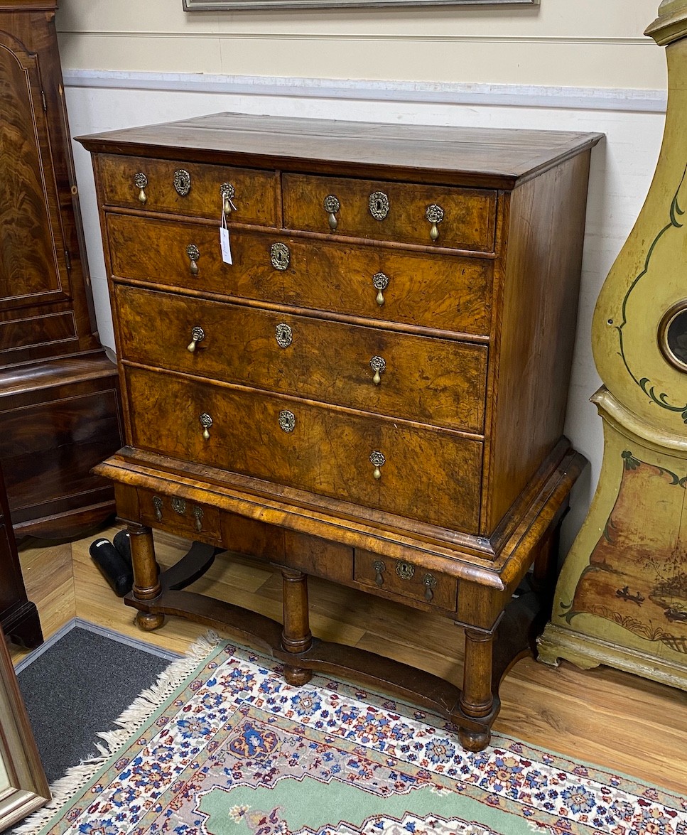 An 18th century walnut chest on stand, width 106cm, depth 61cm, height 127cm